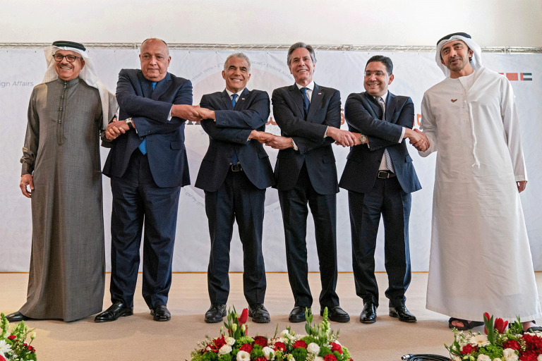 Representatives from the Abraham Accords countries hold hands with Sec. of State Blinken