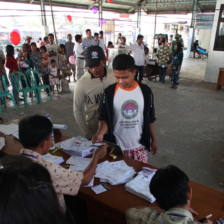 Photo of Indonesian voters at a polling station