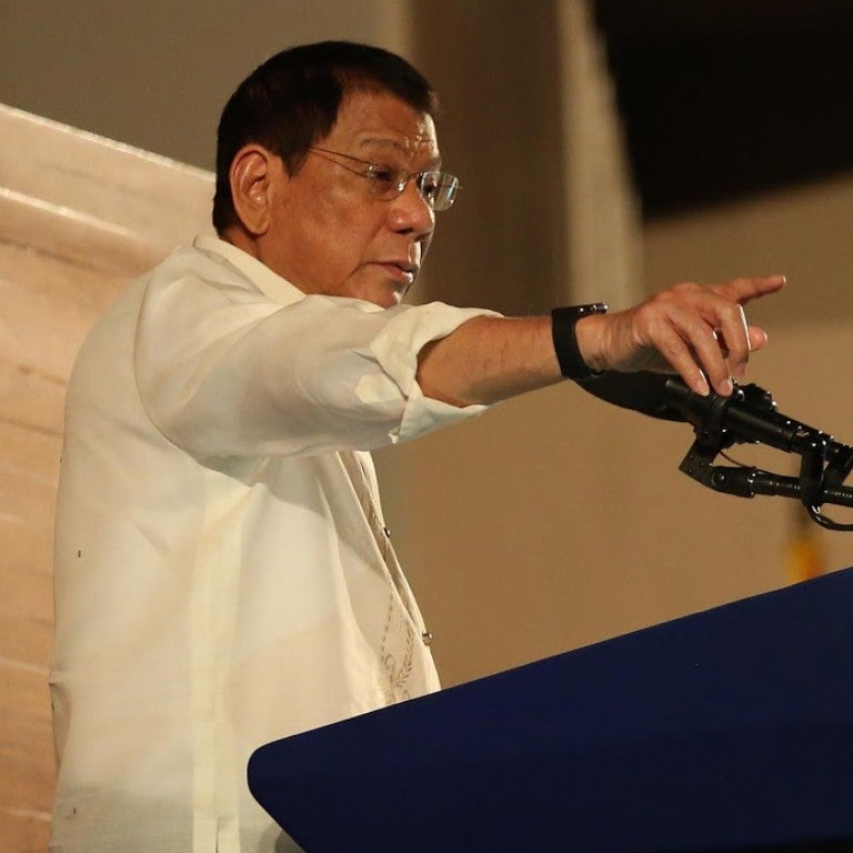 Philippine President Duterte speaks at an event in front of the podium.