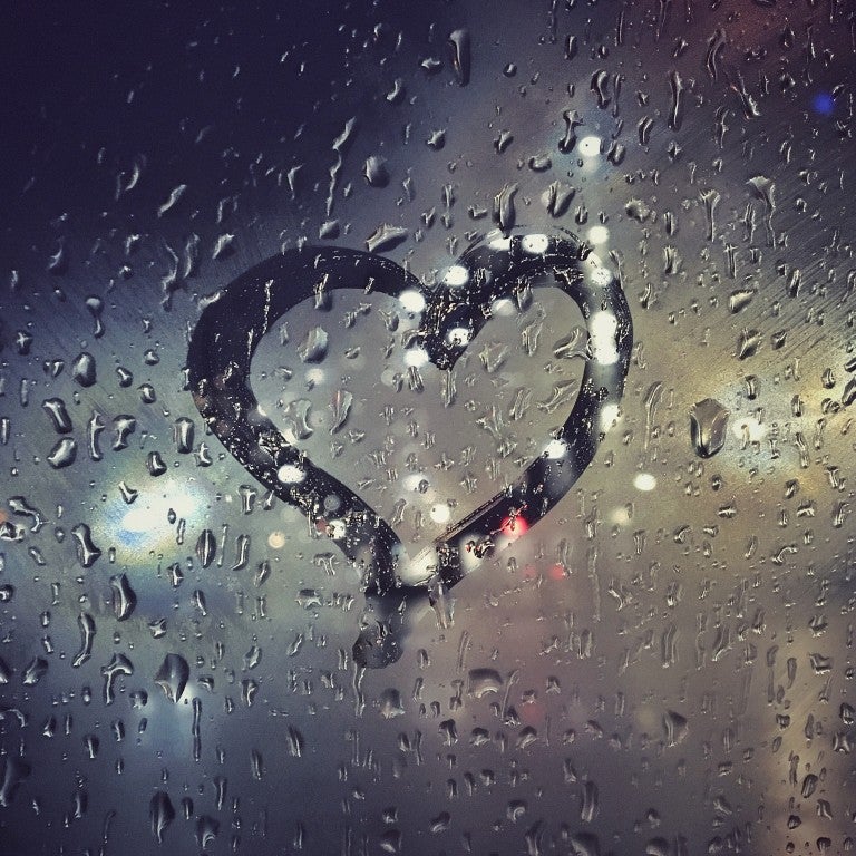 Photo of a heart outline on a window.