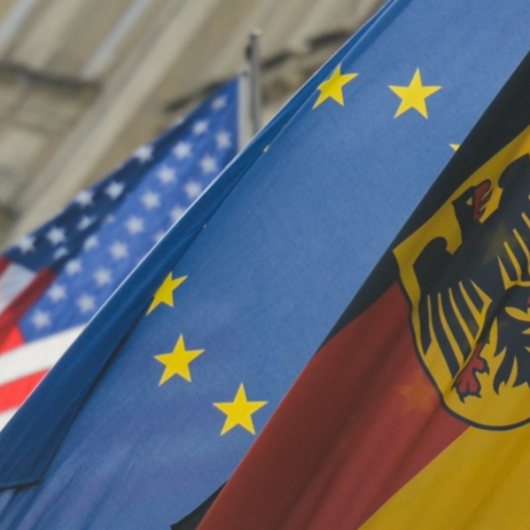 American, EU, and German flags