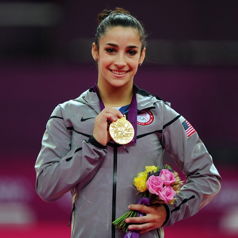 Gold medalist Ally Raisman poses on the podium during the medal ceremony for the Artistic Gymnastics Women's Floor Exercise final on Day 11 of the London 2012 Olympic Games at North Greenwich Arena.