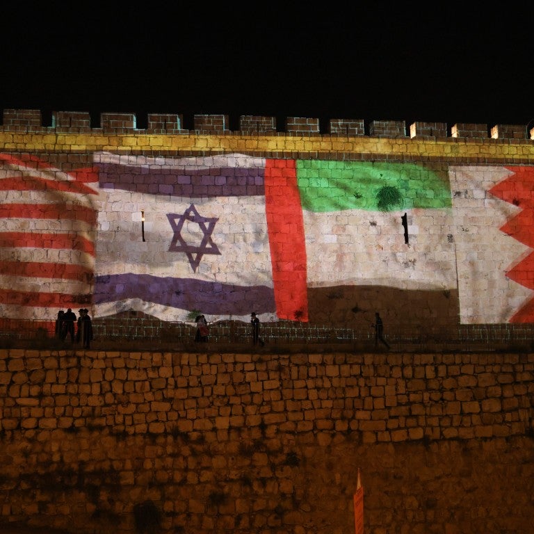 Flags of the US, Israel, UAE, and Bahrain alight the wall of the Old City of Jerusalem 
