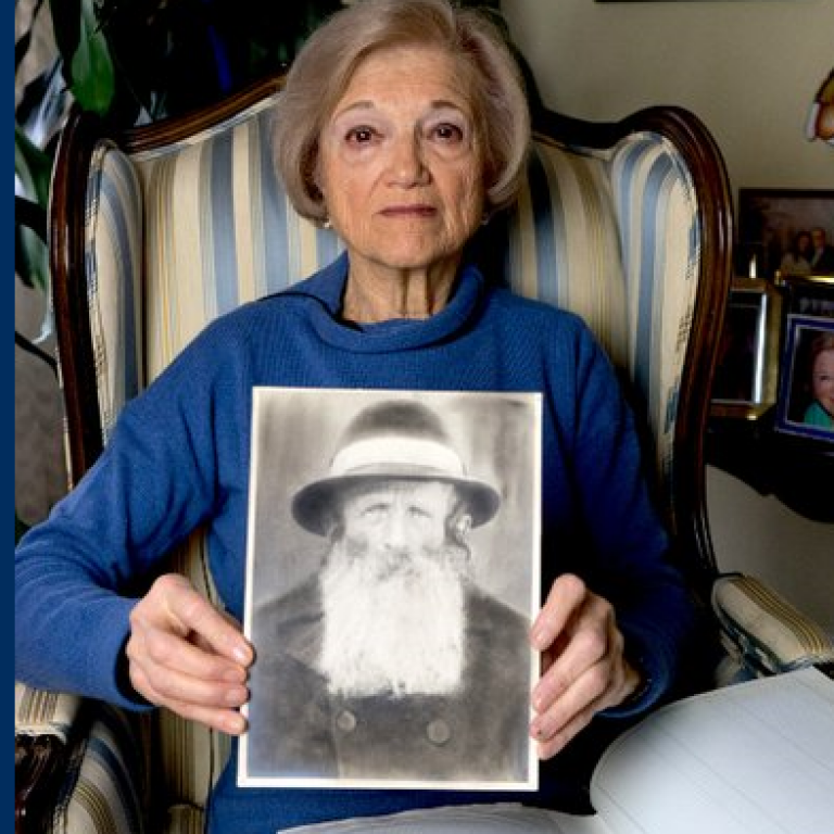Toby Levy holding a picture of her father