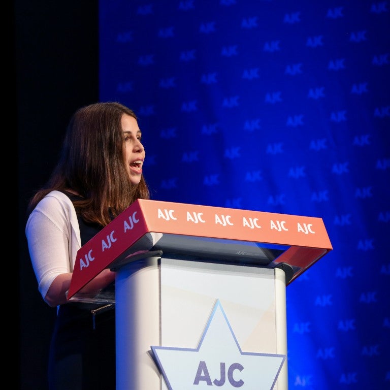 Photo of Natali Kahn speaking at AJC Global Forum 2022