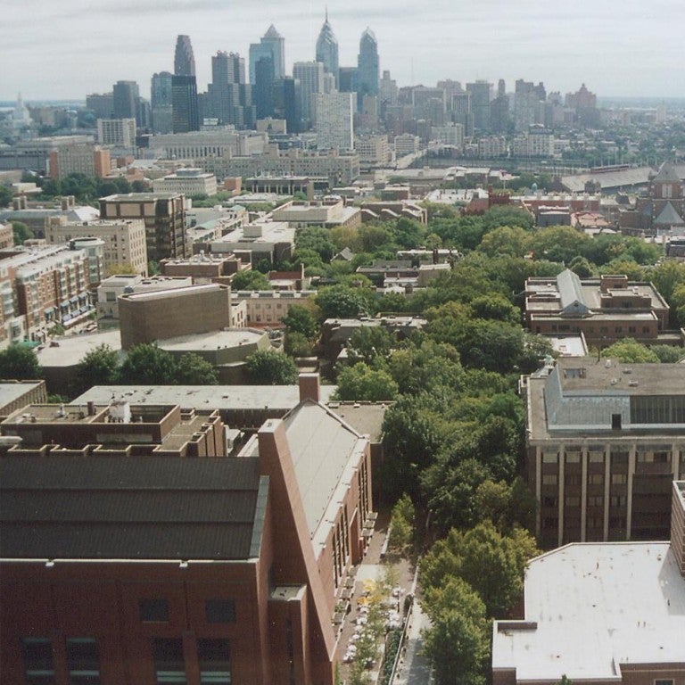University of Pennsylvania campus buildings from above in the foreground, bird's eye view with the skyline of Philadelphia in the background