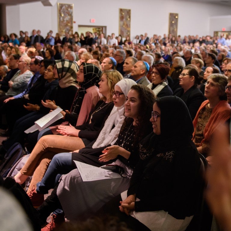 PITTSBURGH, PA - NOVEMBER 2: Over 1000 people crammed into the sanctuary at Temple Sinai for Friday evening Shabbat services on November 2, 2018 in Pittsburgh, Pennsylvania. Temple Sinai, just a half mile from Tree of Life Synagogue in the Squirrel Hill neighborhood, opened their doors to Pittsburgh-area Jews and people of all faiths in the wake of the mass shooting that left 11 people dead at the Tree of Life on October 27, 2018.(Photo by Jeff Swensen/Getty Images)