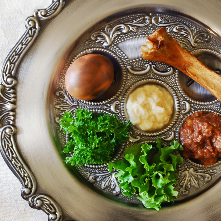 silver seder plate with egg, parsley, shakbone, charoset