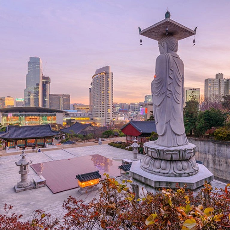 Photo of sunset at Bongeunsa temple of downtown skyline in Seoul City,