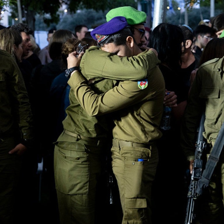 Soldiers mourn during a funeral for IDF soldier Sergeant Michael Ruzal Killed in a rocket attack in Southern Israel on May 6, 2024 in Rishon LeZion, Israel. 