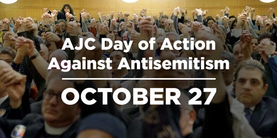 AJC National Day of Action Against ANtisemitism Photo of Worshippers Raising Arms