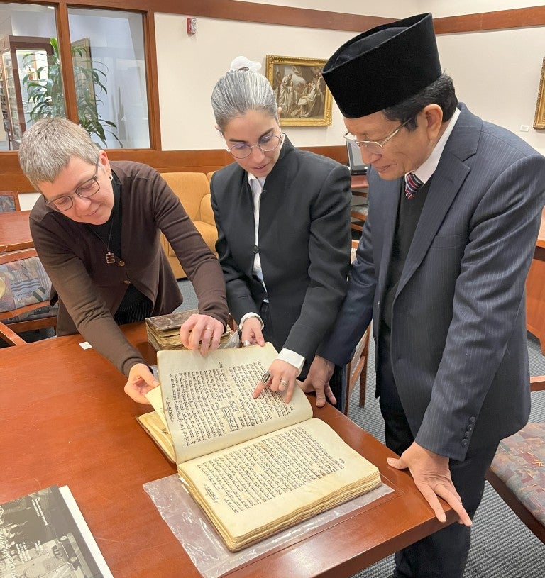 Grand Imam Umar learns about the work of the Center for Jewish Studies at Fordham University with co-directors Rabbi Dr. Sarit Kattan Gribetz and Dr. Magda Teter.
