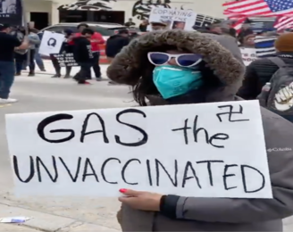 A counter-protester at an antivaccine rally in San Antonio, Texas on February 12, 2022. Image captured from @StopAntisemites.