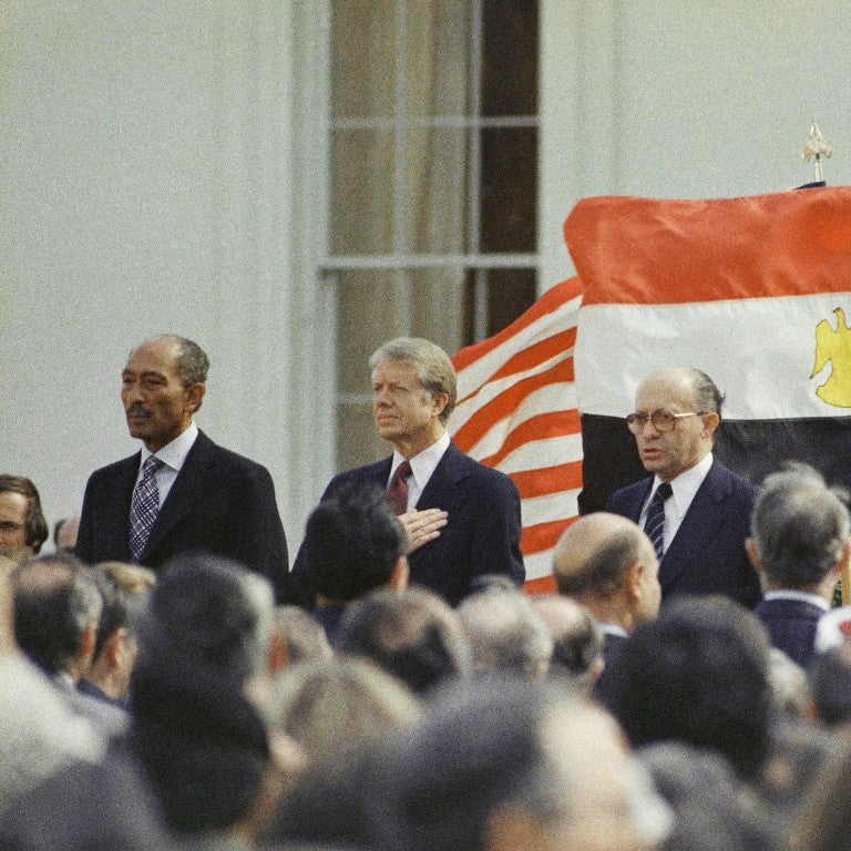 Photo of Carter, Sadat and Begin celebrating Egypt Israel Treaty