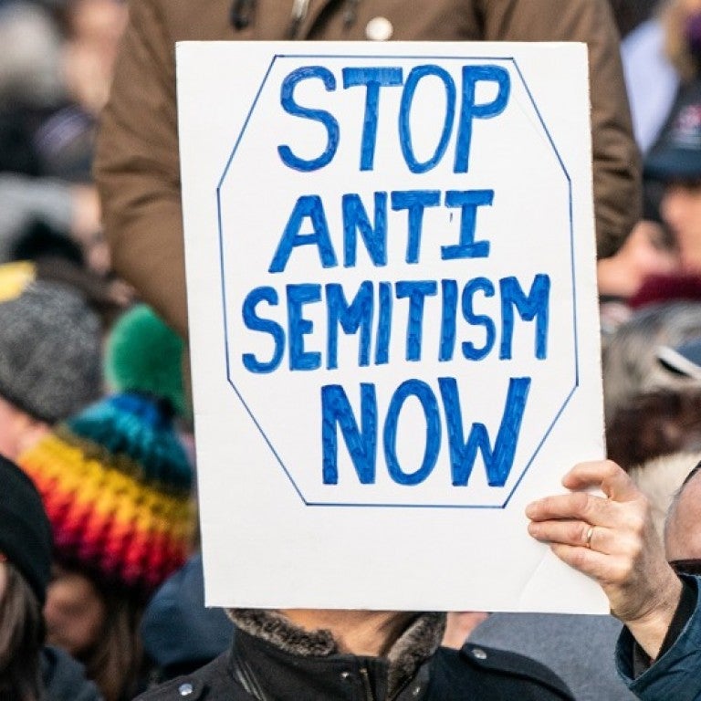 Sign saying stop antisemitism now