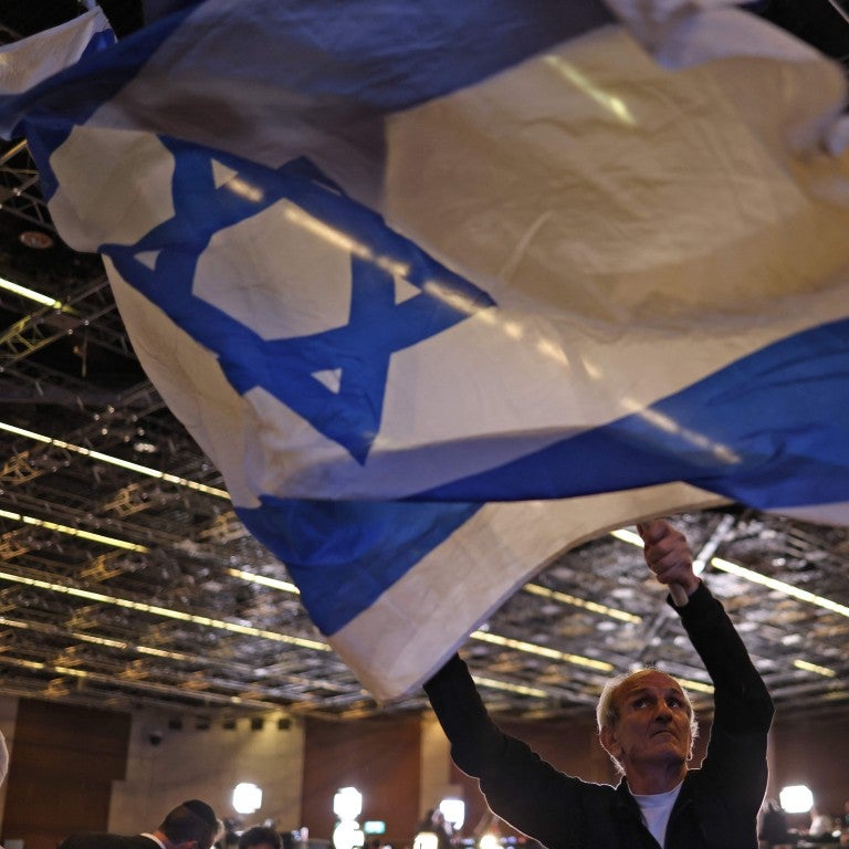 Man waving an IsraeliFlag