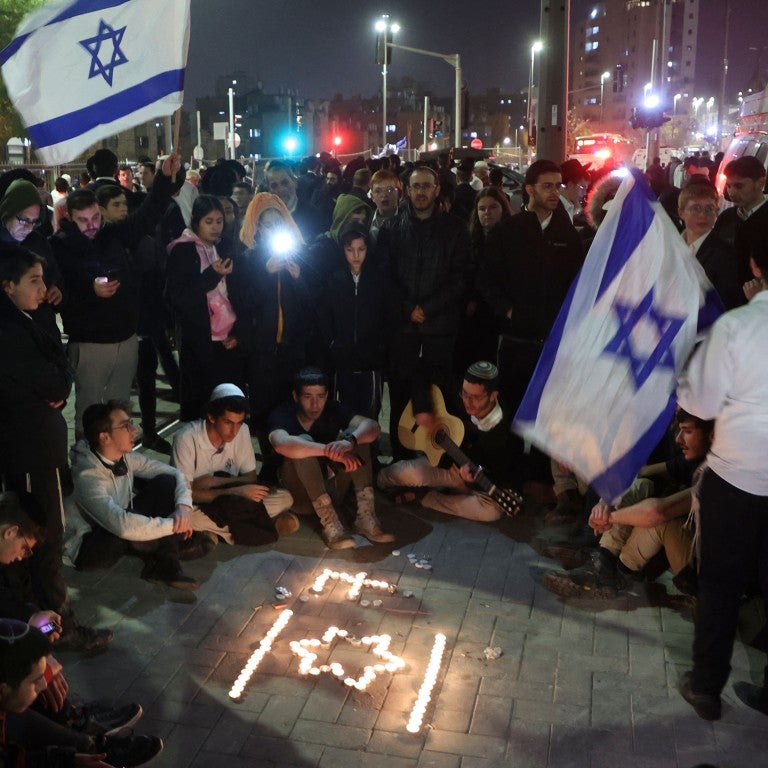 Israelis gather to mourn the deaths of seven worshippers in Jerusalem