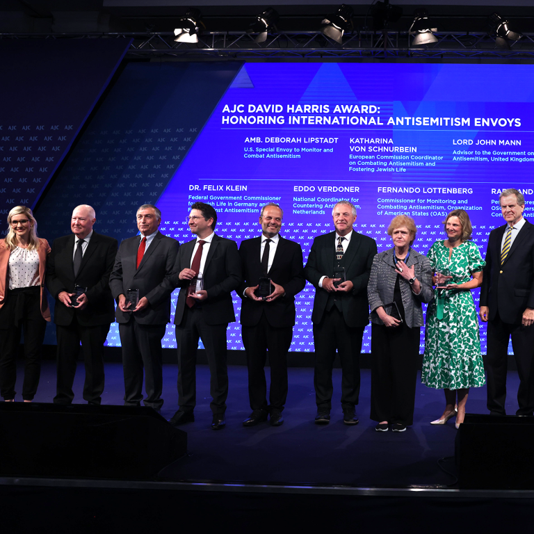 Seven international antisemitism envoys with Holly Huffnagle and David Harris at AJC Global Forum 2023