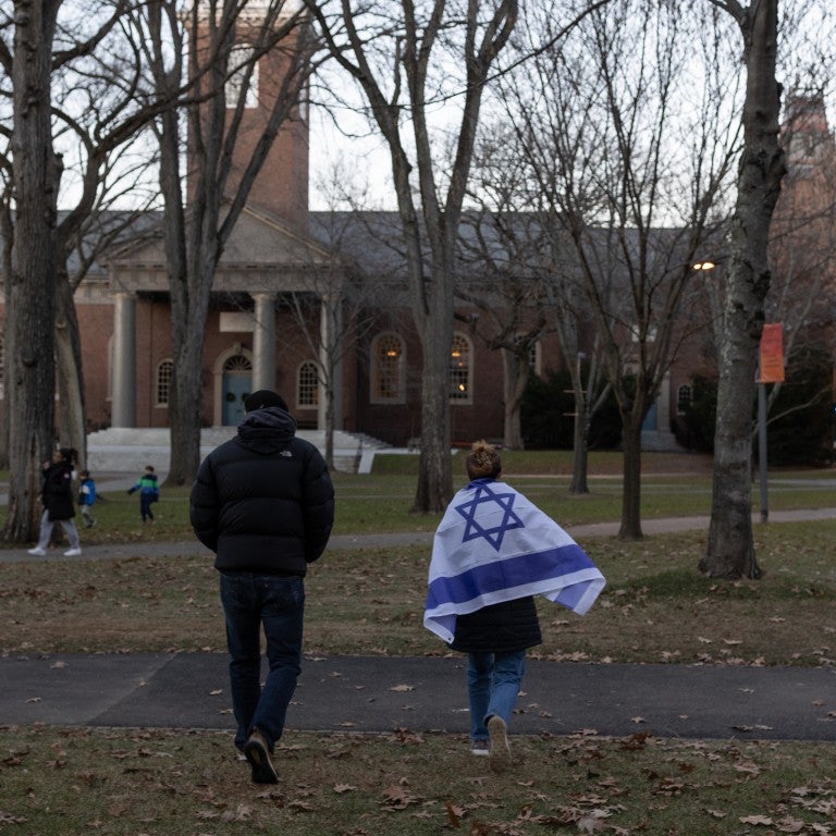 People attend a menorah lighting ceremony on the seventh night of Hanukkah with Harvard's Jewish community on December 13, 2023, in Harvard Yard, Cambridge, Massachusetts. The campus had been in turmoil over divided opinions about Israel's war in the Gaza Strip, with the Jewish community saying they do not feel supported or protected by the university.