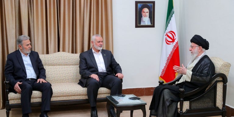 Ali Khamenei, the Supreme Leader of Iran (R), meets with Ismail Haniyeh (C), head of the political bureau of Hamas, and Ziyad al-Nakhalah, the Secretary General of the Palestinian Islamic Jihad Movement before noon on July 30, 2024. on July 30, 2024 in Tehran, Iran. Haniyeh, who lived in Qatar, was visiting Tehran this week for the new Iranian president's inauguration.