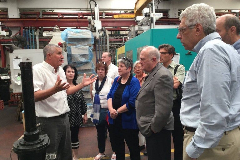 Group of University Alumni visiting a manufacturing plant