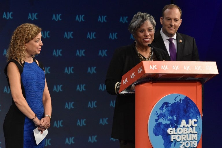 Photo of Rep. Brenda Lawrence addressing AJC Global Forum 2019 with Reps. Debbie Wasserman-Schultz and Lee Zeldin.