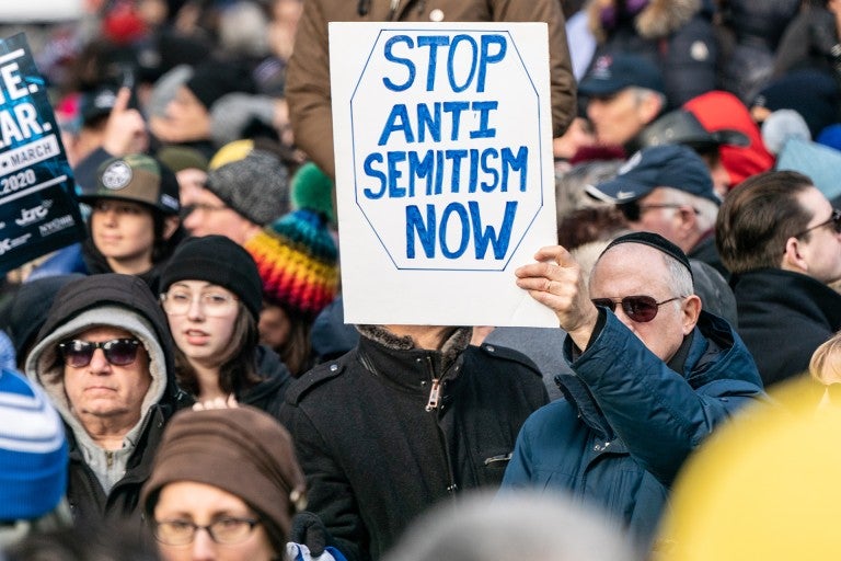 Rally against antisemitism, sign that reads "stop antisemitism now"