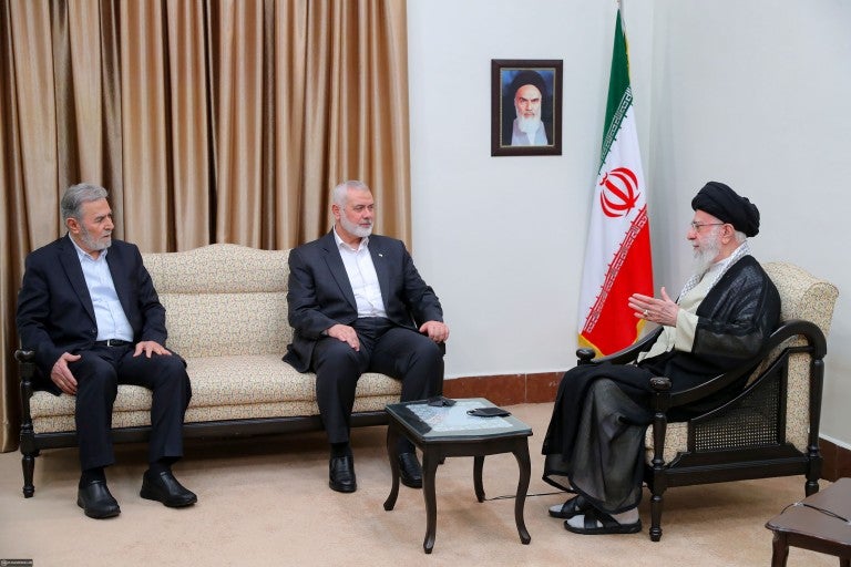 Ali Khamenei, the Supreme Leader of Iran (R), meets with Ismail Haniyeh (C), head of the political bureau of Hamas, and Ziyad al-Nakhalah, the Secretary General of the Palestinian Islamic Jihad Movement before noon on July 30, 2024. on July 30, 2024 in Tehran, Iran. Haniyeh, who lived in Qatar, was visiting Tehran this week for the new Iranian president's inauguration.