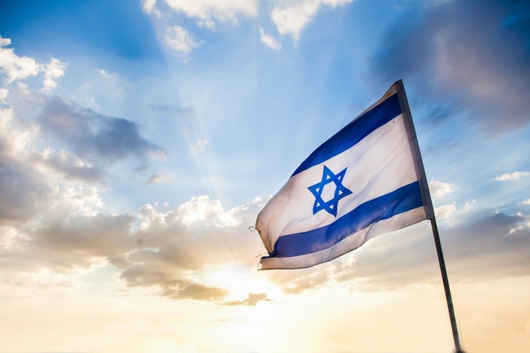 Israeli flag at sunset.