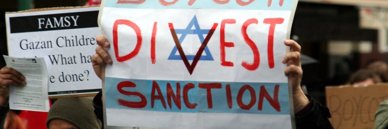 Photo of a Boycott Divest Sanction sign at a BDS protest