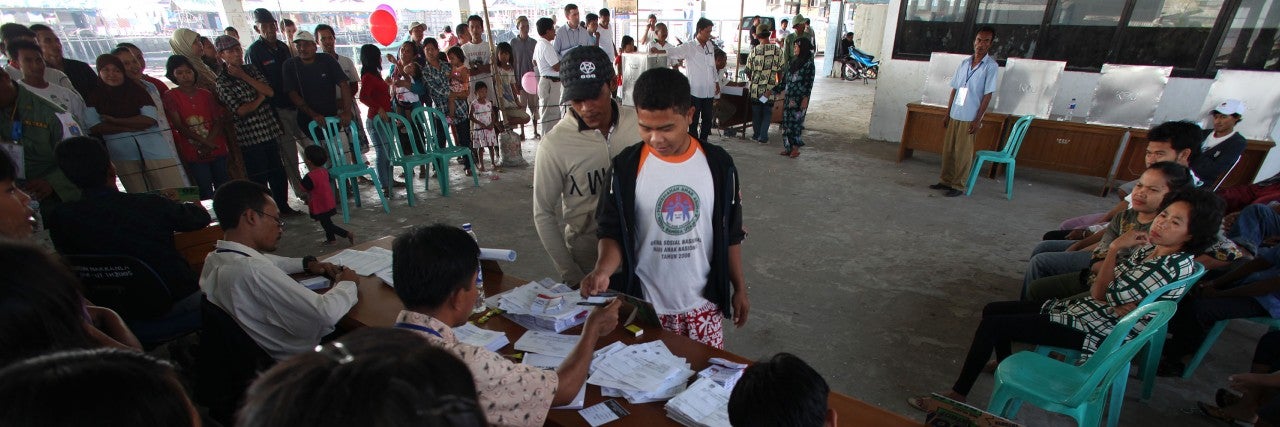 Photo of Indonesian voters at a polling station