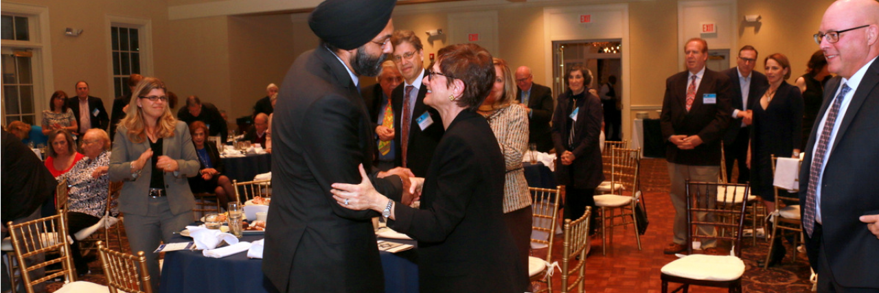 AG Grewal shaking hands with AJC Metro New Jersey's Board President, Genesia Perlmutter Kamen at AJC New Jersey Metro Annual Meeting and Dinner 