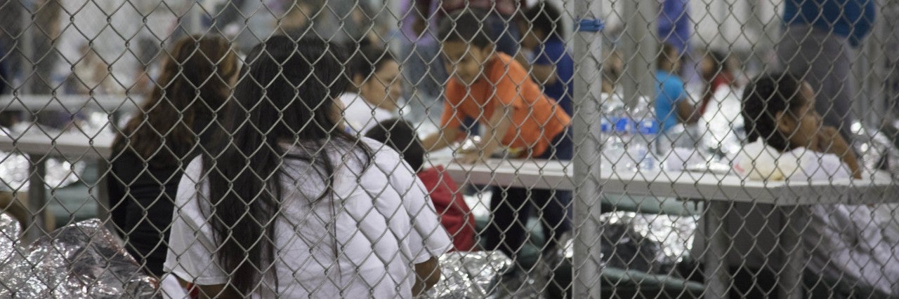Photo of children in separation detention facility cages