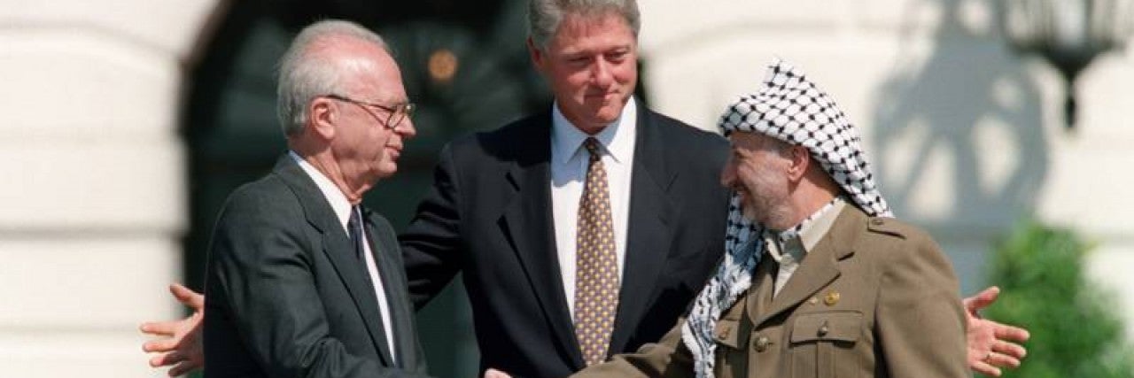 Photo of U.S. President Bill Clinton with Israeli Prime Minister Yitzhak Rabin and Palestine Liberation Organization Chairman Yasser Arafat