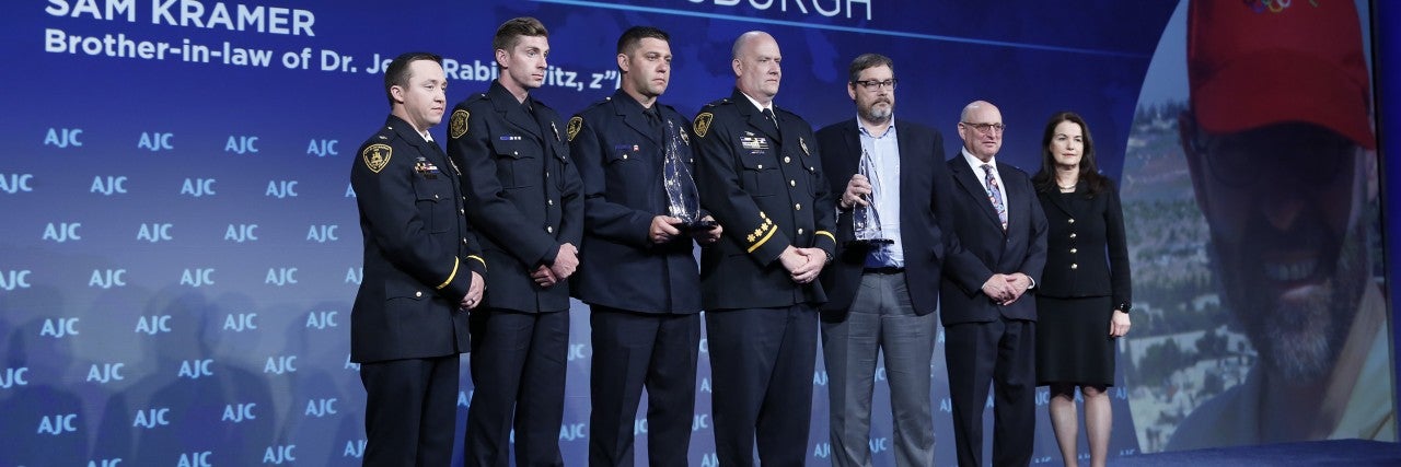 Photo of Pittsburgh First Responders receiving the AJC Moral Courage Award at AJC Global Forum 2019