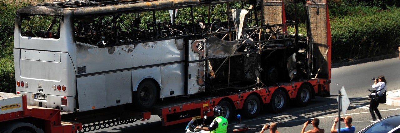A truck carries the bus damaged by the suicide bomb blast which targeted a group of Israeli tourists at the airport in Bourgas, Bulgaria, on July 19, 2012.