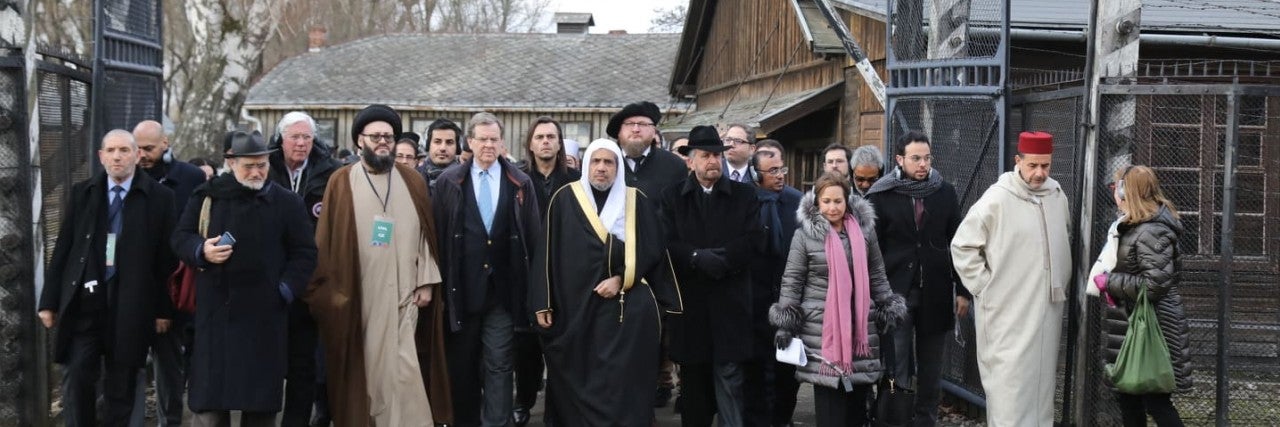 American Jewish Committee and Muslim World League Historic walking through the "Arbeit Macht Frei" gate at Auschwitz 