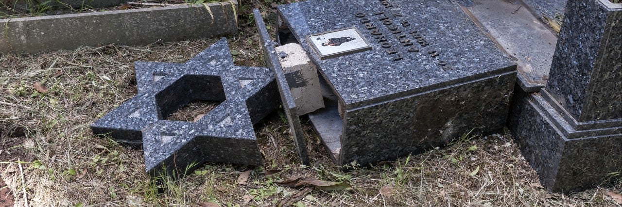 knocked over Jewish headstone