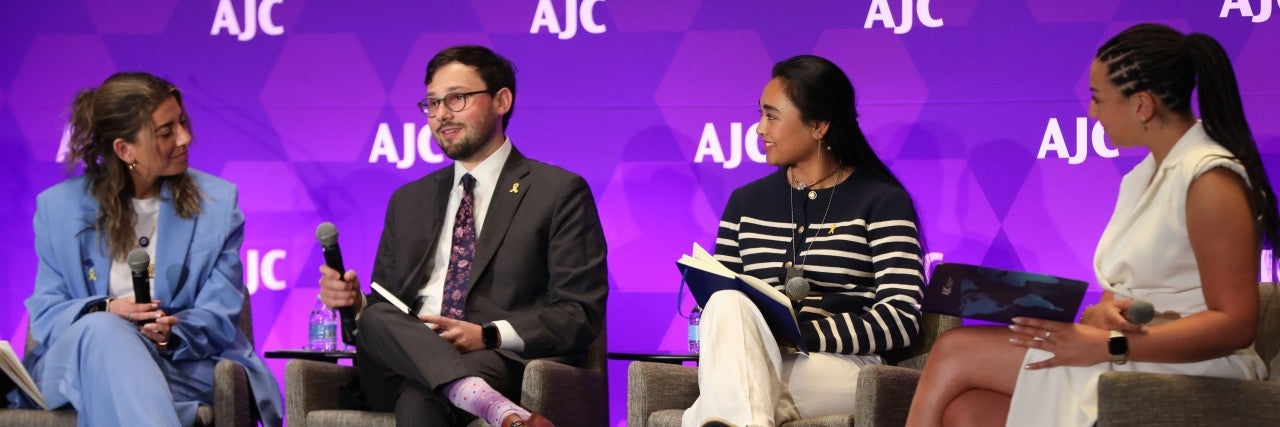 Group of student speaking on stage at AJC's 2024 Global Forum