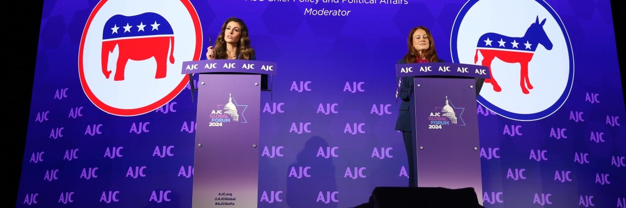 Photo of Morgan Ortagus and Halie Soifer at AJC Global Forum behind podiums for The Great Debate: Election 2024