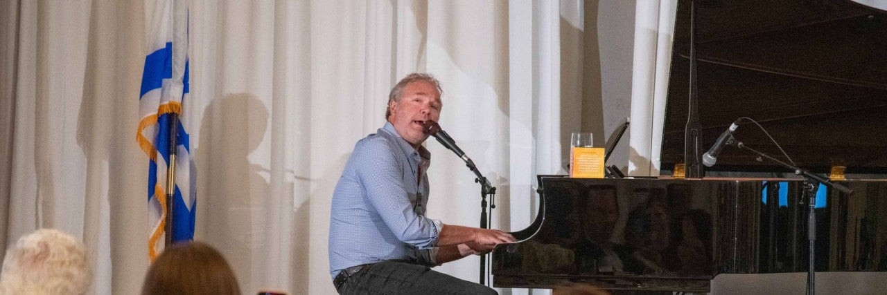 John Ondrasik playing piano.