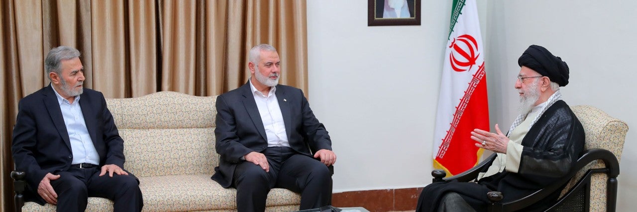 Ali Khamenei, the Supreme Leader of Iran (R), meets with Ismail Haniyeh (C), head of the political bureau of Hamas, and Ziyad al-Nakhalah, the Secretary General of the Palestinian Islamic Jihad Movement before noon on July 30, 2024. on July 30, 2024 in Tehran, Iran. Haniyeh, who lived in Qatar, was visiting Tehran this week for the new Iranian president's inauguration.