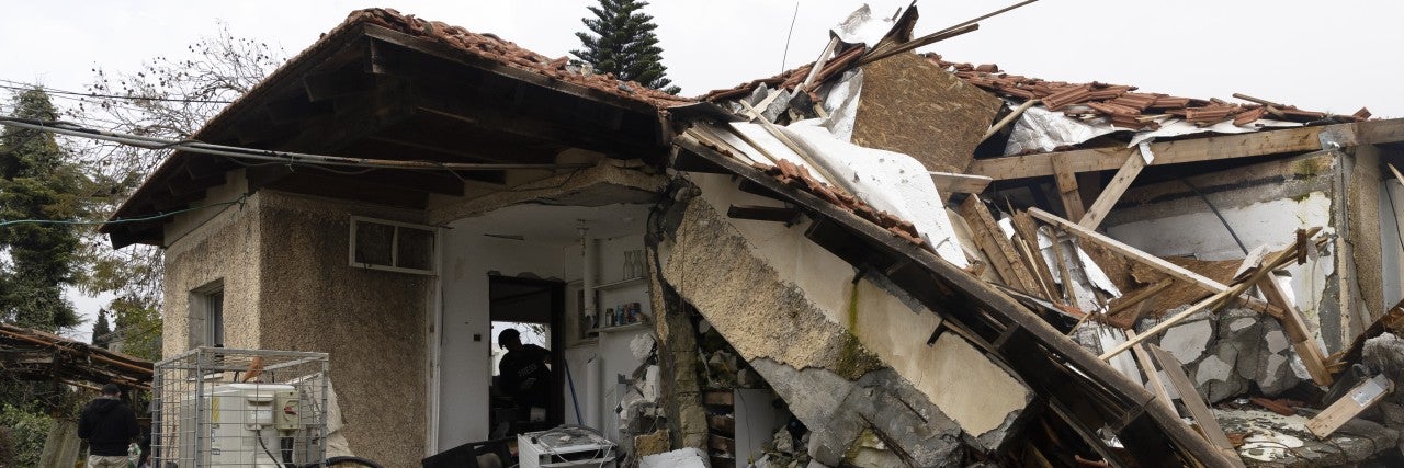 METULA, ISRAEL - MARCH 19: A journalist views a house that was damaged by a rocket fired from Lebanon by Hezbollah during a tour organized for journalists in a northern village on March 19, 2024 in Metula, Israel. Israel and Hezbollah, the Iran-backed militant and political group in Lebanon, have traded near daily strikes in recent months, as the war in Gaza has stoked regional hostilities. 