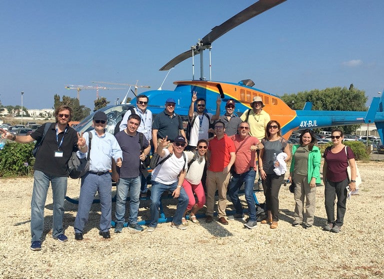 Delegation getting ready to take a helicopter ride.