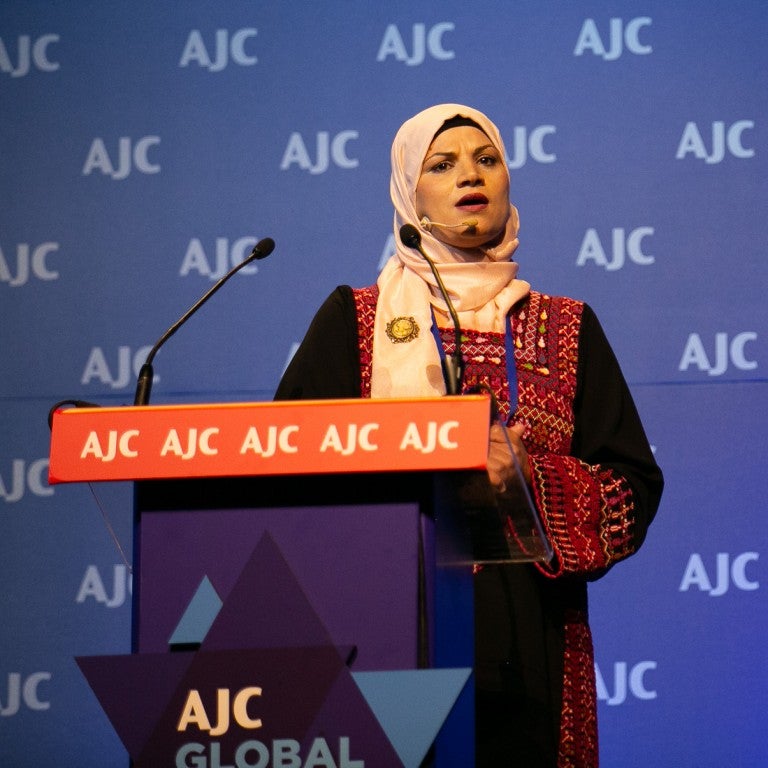Photo of Ahlam Alsana speaking at AJC Global Forum 2018
