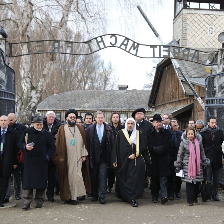 American Jewish Committee and Muslim World League Historic walking through the "Arbeit Macht Frei" gate at Auschwitz 