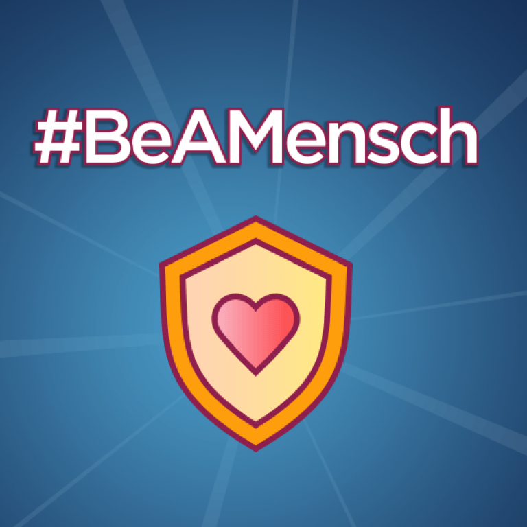 Logo of a shield with a heart in it. With text #BeAMensch.