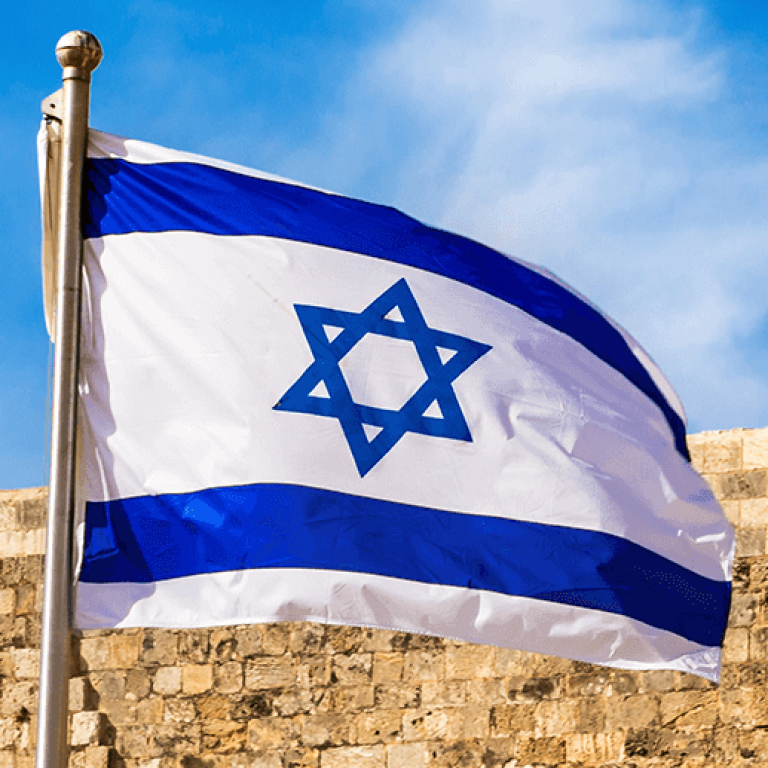 Israeli flag in front of wall