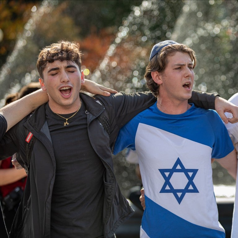 Pro-Israel counter-protesters sing arm-in-arm during a rally as students call for a ceasefire in Gaza Planned walkouts by students on college campuses across the country were organized calling for an end to the retaliation bombing of Gaza after the Palestinian militant group launched a deadly attack in southern Israel on October 7.