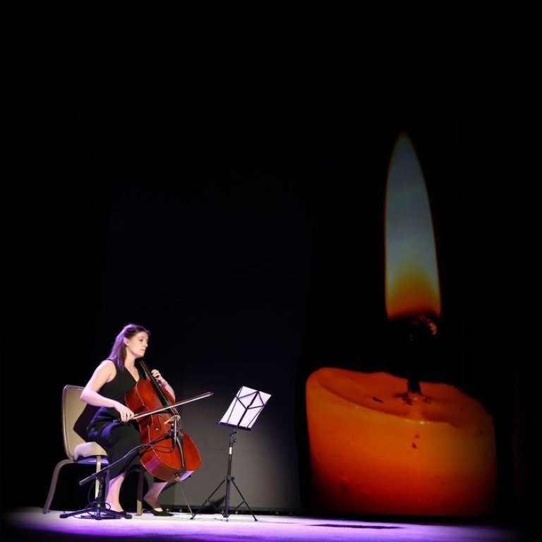 Image of woman playing violin as AJC Pays Tribute to the Victims of the October 7 Hamas Massacre